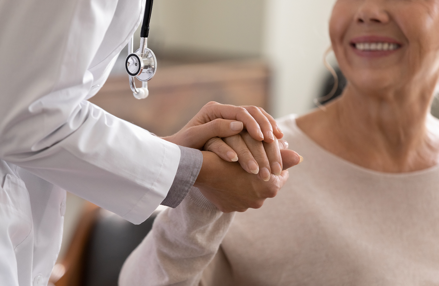 A health care provider greets a cancer patient.