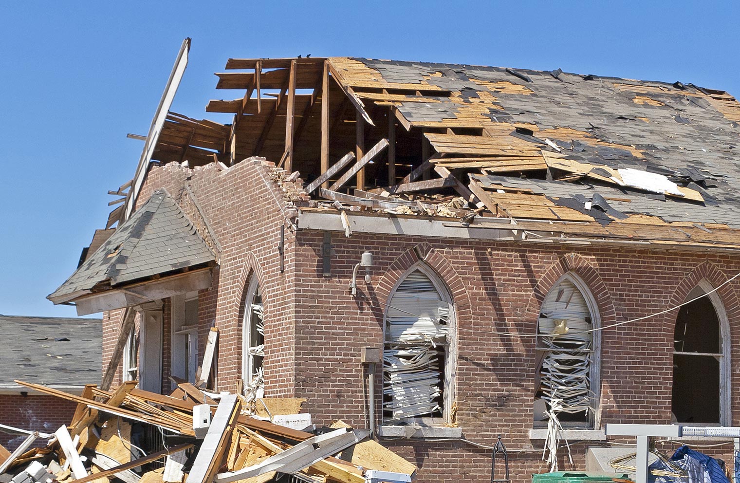 Image of house with severe roof damage