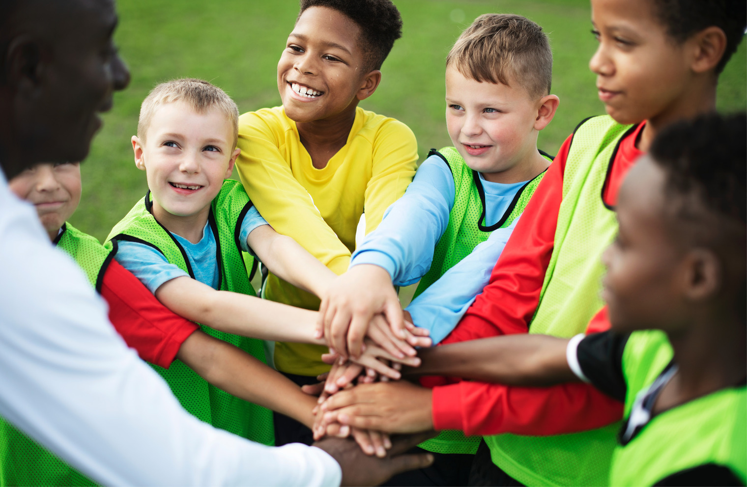 Picture of children in a pre game soccer huddle