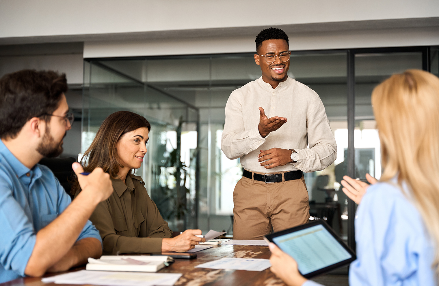 People sitting around a table discussing finances